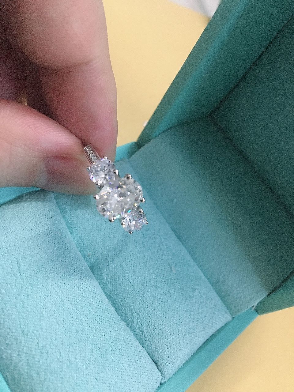 Customer photo review of Three Stone Oval Moissanite Channel-Set Engagement Ring