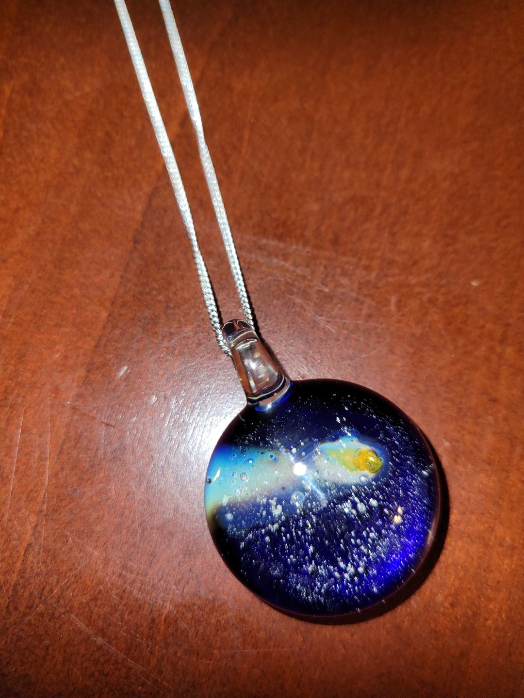 Customer photo review of Halley's Comet Glass Pendant