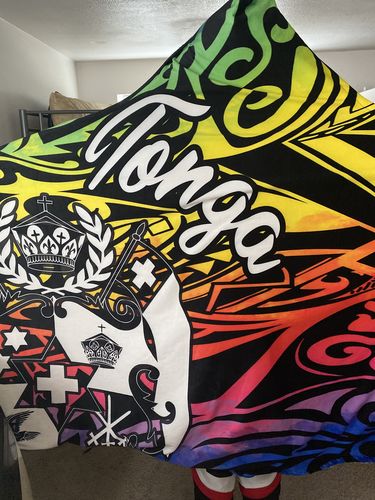 Customer photo review of Tonga Hooded Blanket - Rainbow Polynesian Pattern