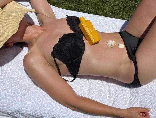 Customer photo review of Melanoboost Peptide Sun Tanning Oil