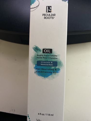 Customer photo review of Nourishing & Conditioning Hair Oil - Oil on Label  | 4 oz