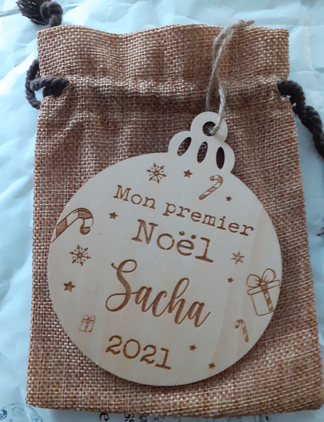 Customer photo review of Boule de Noël en bois Personnalisable - Mon premier Noël