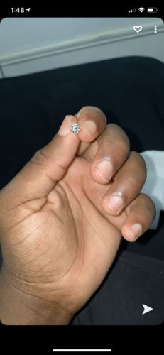 Customer photo review of VVS Moissanite Solitaire Stud Earrings