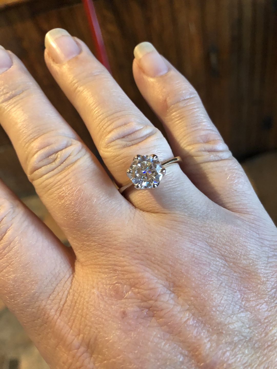 Customer photo review of Doveggs round flower shape solitaire moissanite engagement ring