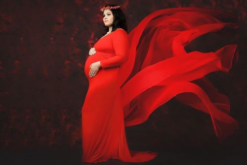 Customer photo review of Exclusive Cherry Red Trail Maternity Photoshoot Gown