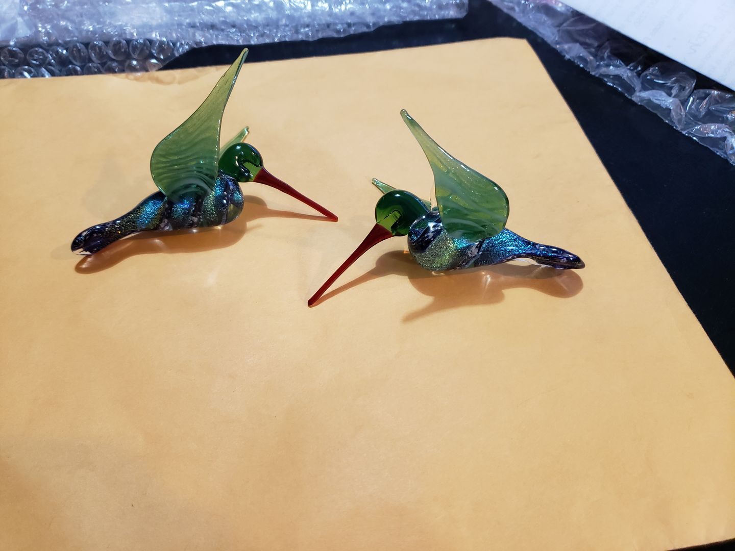 Customer photo review of Dichroic Twist Glass Hummingbird with Infused Ash