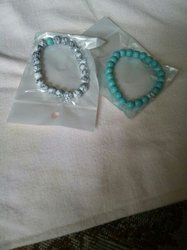Customer photo review of His & Hers Distance Bracelets