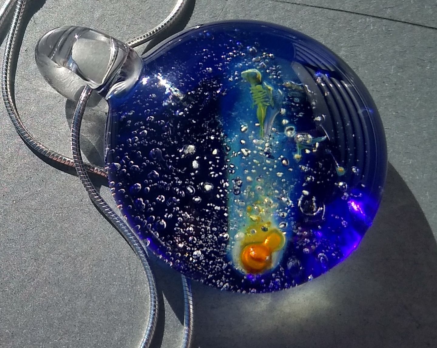 Customer photo review of Halley's Comet Glass Pendant