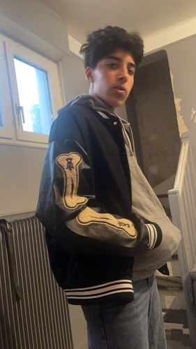 Customer photo review of "Blessed" Varsity Jacket