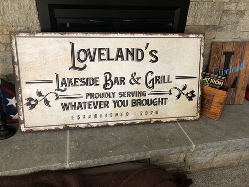 Customer photo review of Backyard Bar & Grill Sign