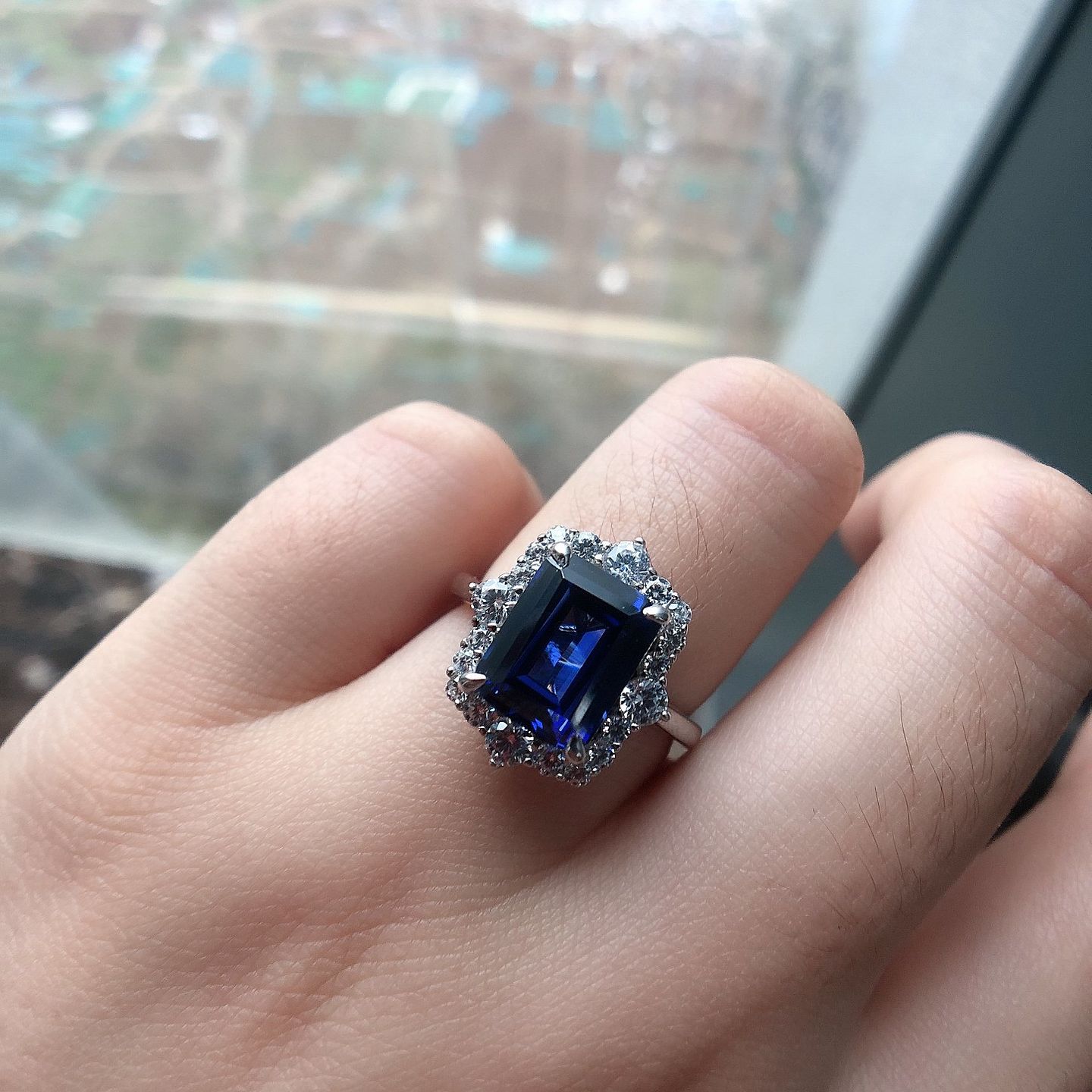 Customer photo review of S925 3.0 Carat Halo Emerald Cut Blue Sapphire Engagement Ring In Sterling Silver