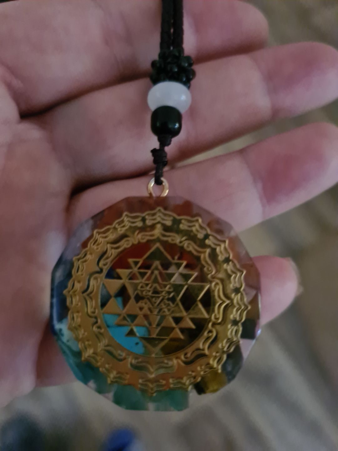 Customer photo review of Sacred Sri Yantra Orgonite Chakra Necklace