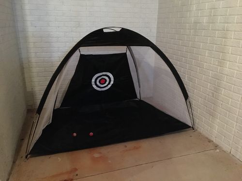 Customer photo review of Golf Practice Driving Net for Indoors and Outdoors | Tri-Turf Hitting Mat