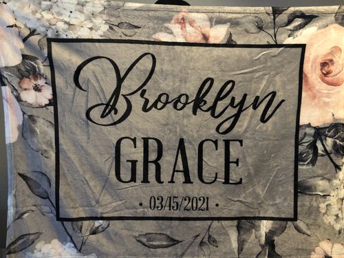 Customer photo review of Gray Pink Floral Black Text Custom Name Printed Fleece Baby Blanket