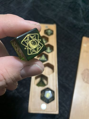 Customer photo review of URWizards Dnd Peridot Glass Engraved Dice Set Astrology Style