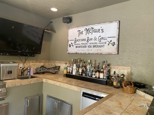 Customer photo review of Backyard Bar & Grill Sign