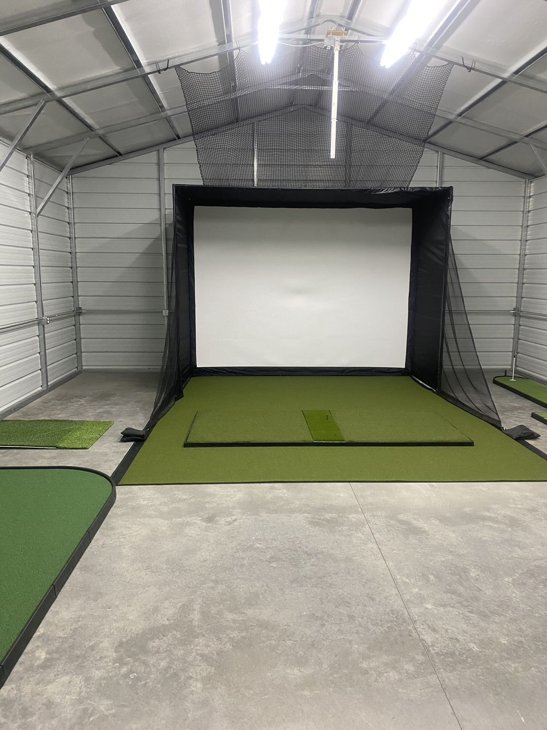 Steel building bay, a customer's golf simulator room