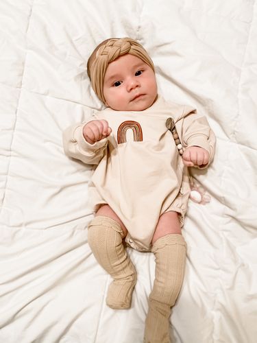 Customer photo review of Oversized rainbow romper in cream