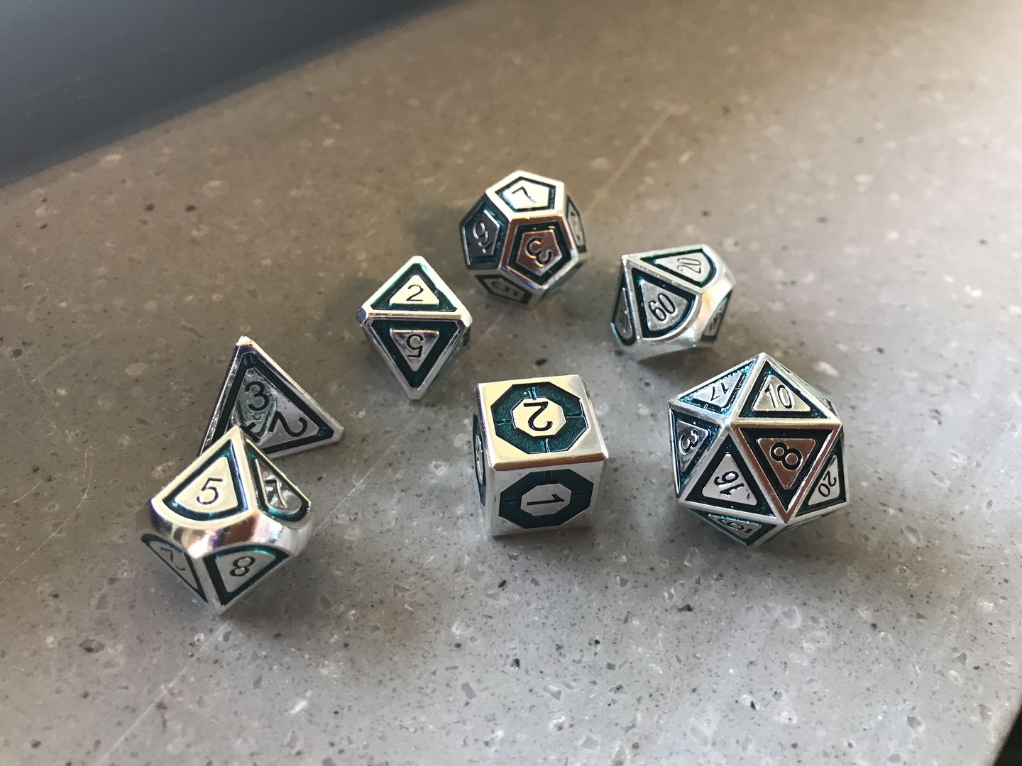 Customer photo review of CLERIC'S DOMAIN AQUA AND SILVER METAL DICE SET
