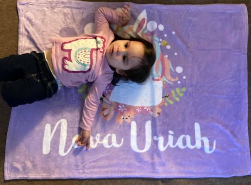 Customer photo review of Lavender Purple Unicorn Floral Custom Name Printed Fleece Baby Blanket