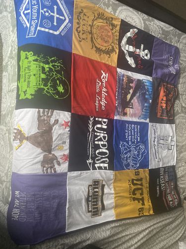 T-shirt quilt with sports, community service themes by Holly from FL