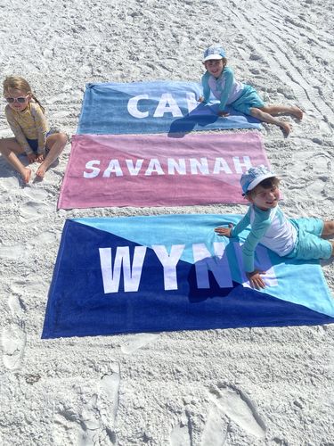Customer photo review of Bold Pink Split Custom Name Beach Towel