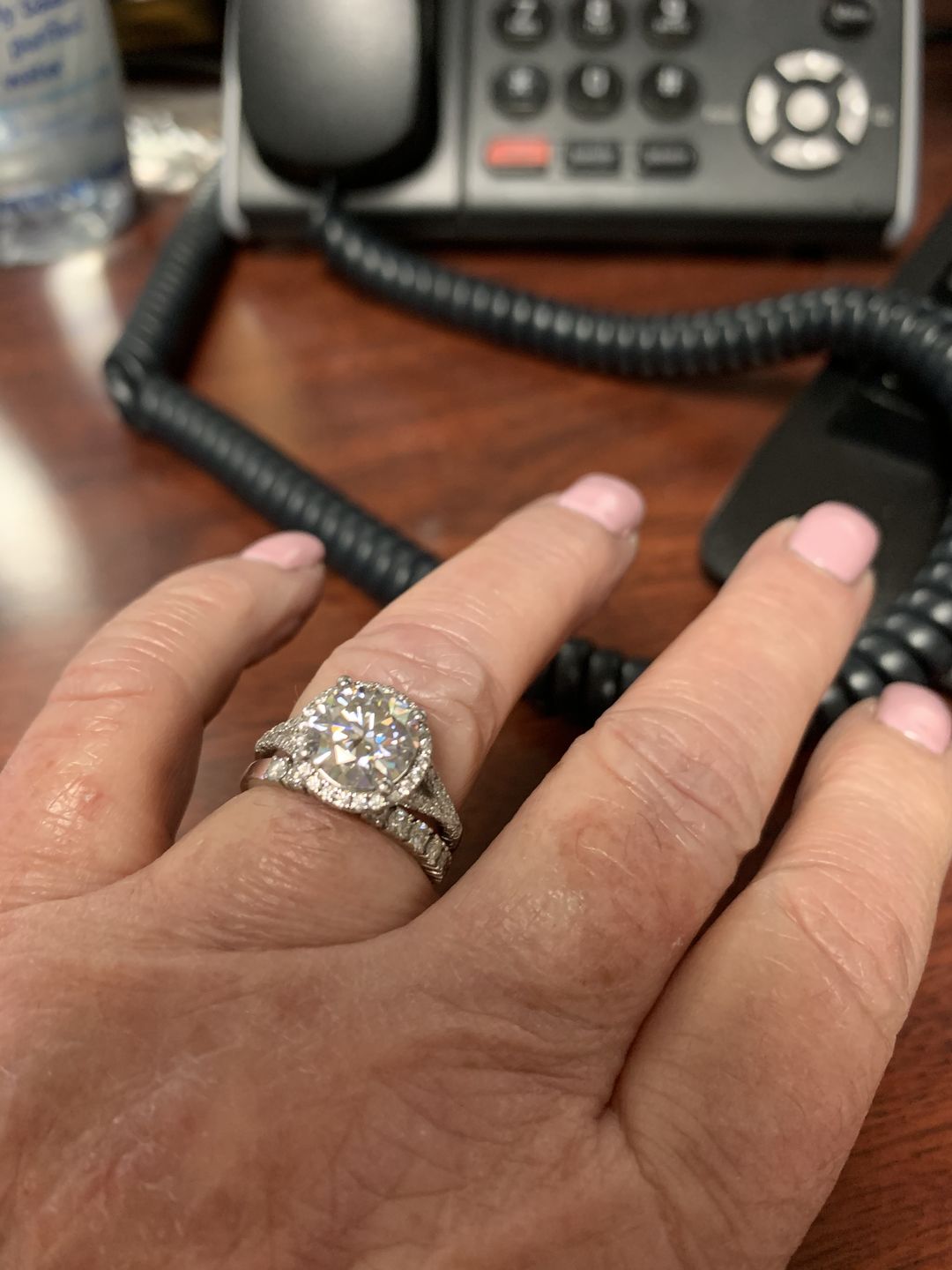 Customer photo review of Moissanite round four prong sterling silver wedding ring
