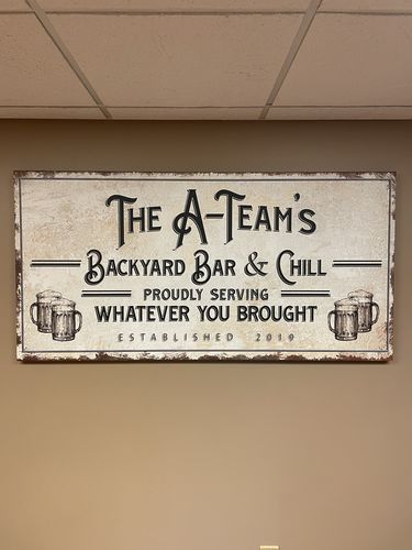 Customer photo review of Backyard Bar & Grill Sign