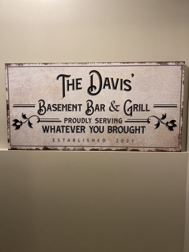 Customer photo review of Backyard Bar & Grill Sign