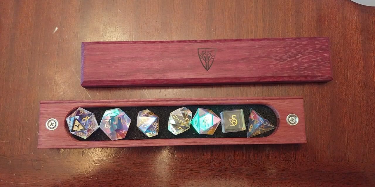 Customer photo review of URWizards Dnd Dichroic Prism Glass Gemstone Engraved Dice Set Triforce