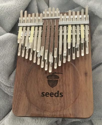 Customer photo review of Seeds 34 Keys Chromatic Kalimba Double Layer Thumb Finger Piano