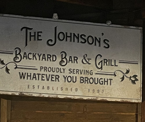 Customer photo review of Backyard Bar & Grill Sign