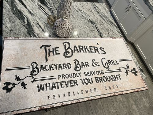 Customer photo review of Backyard Bar & Grill Sign