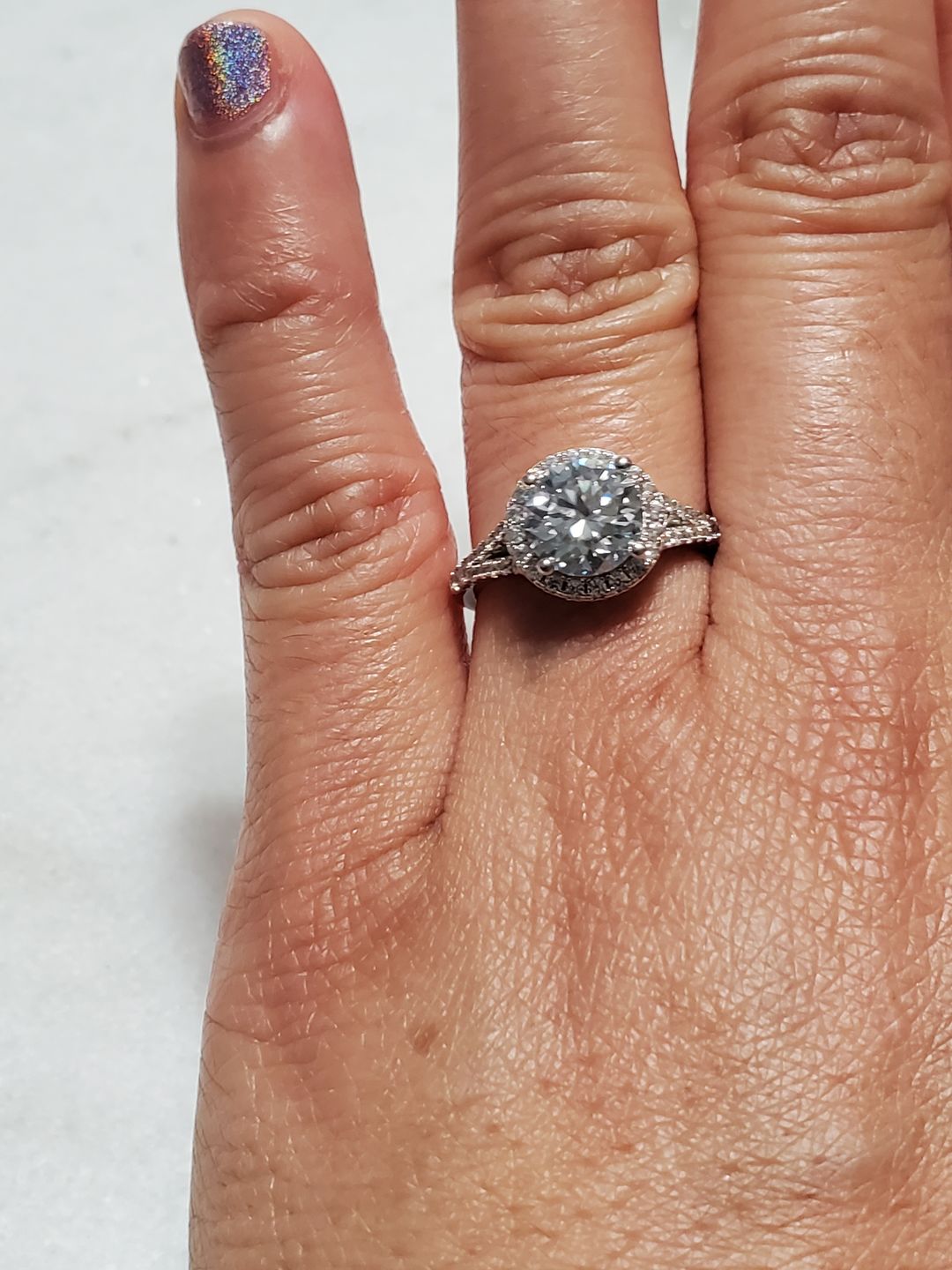 Customer photo review of Round Moissanite Halo Four Prong Pave Sterling Silver Wedding Ring