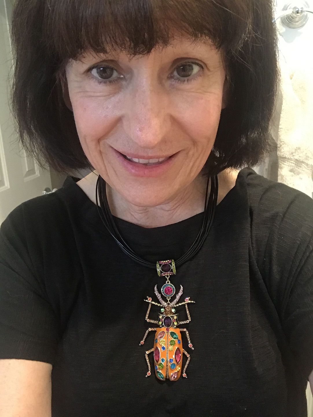 Customer photo review of HEIDI DAUS®"Big Critter" Enamel Crystal Leather Critter Necklace
