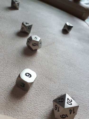 Customer photo review of MATTE SILVER METAL DICE SET
