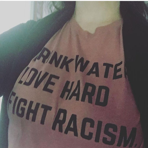 Customer photo review of Drink Water Fight Racism Unisex T-Shirt