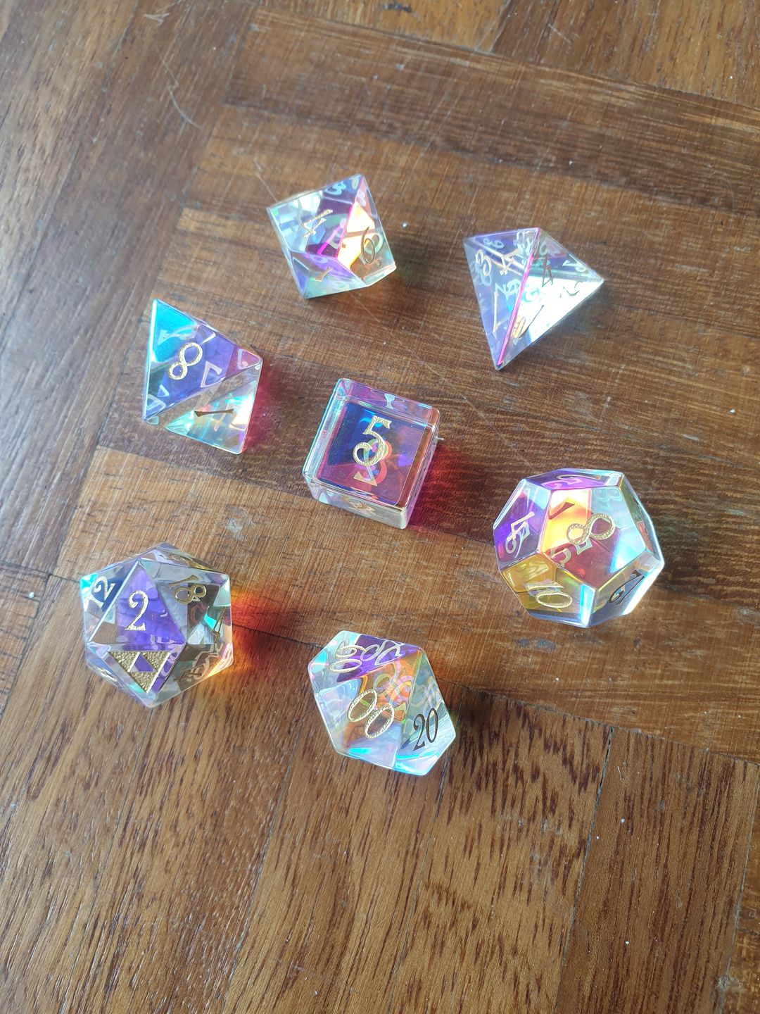 Customer photo review of URWizards Dnd Dichroic Prism Glass Gemstone Engraved Dice Set Triforce