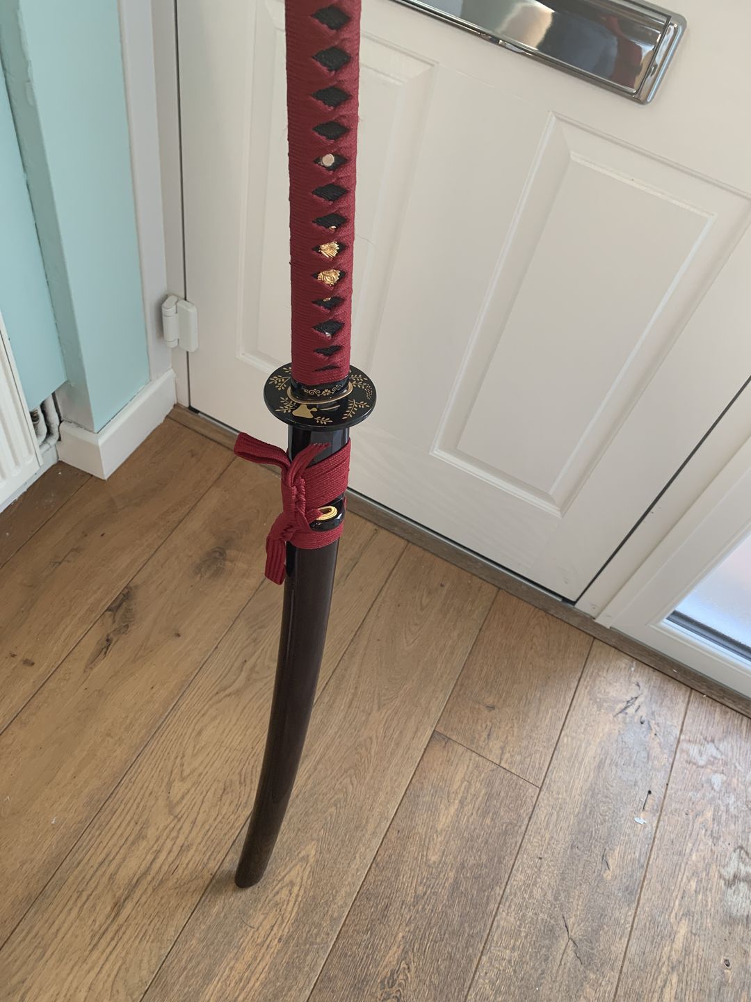 Customer photo review of Black Red Folded Steel Full Tang Blade Japanese Battle Ready Sword Katana