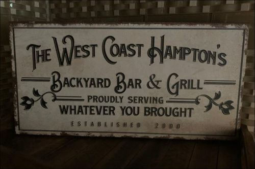Customer photo review of Backyard Bar & Grill Sign