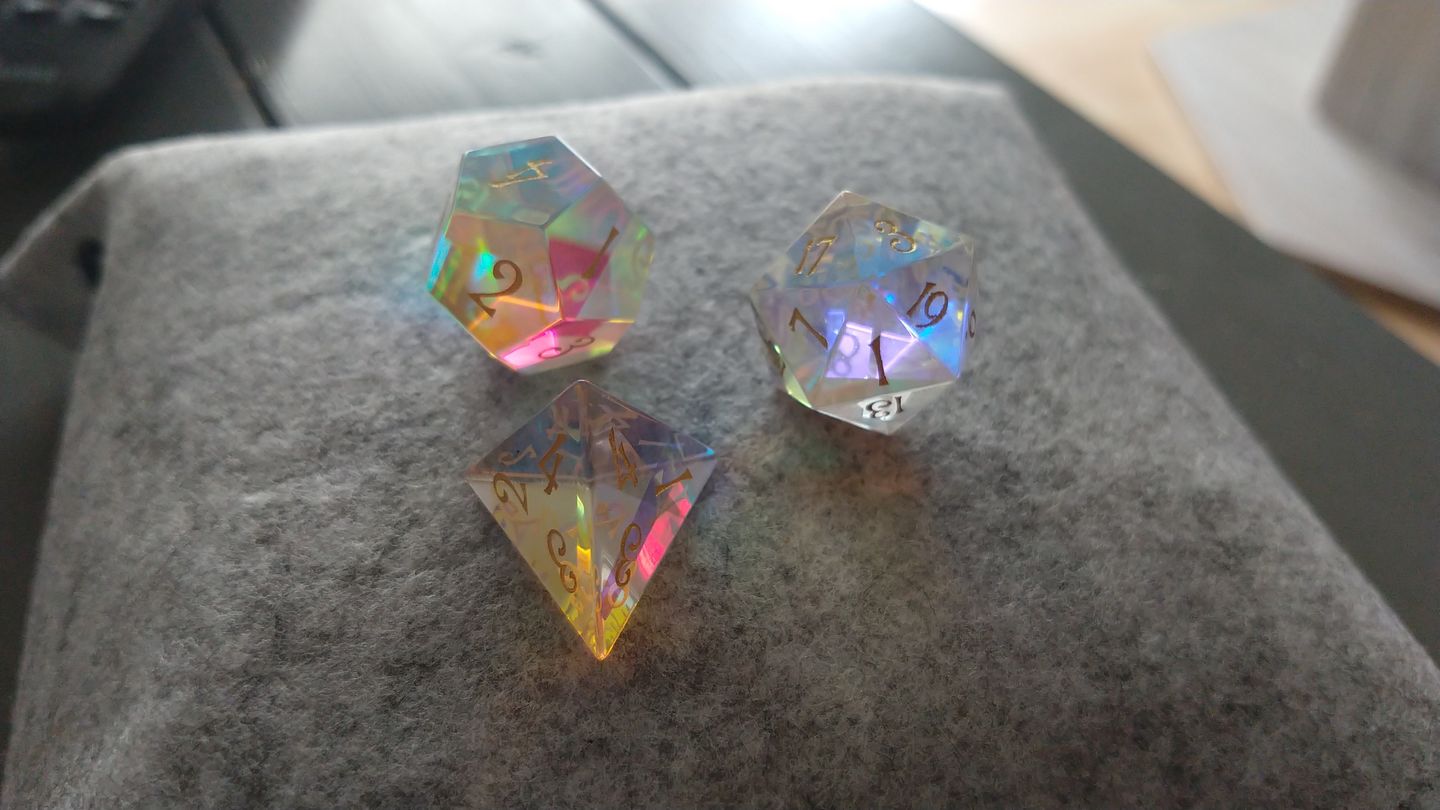 Customer photo review of URWizards Dnd Dichroic Prism Glass Gemstone Engraved Dice Set