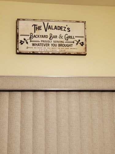 Customer photo review of Backyard Bar & Grill Sign