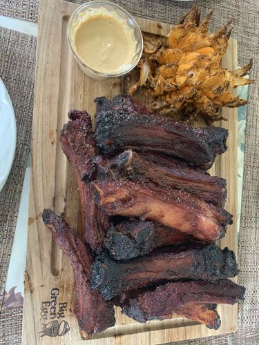 Reseña con foto de un cliente sobre Costillas