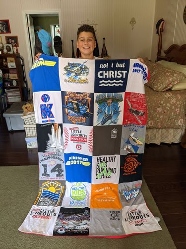 T-shirt quilt with running, fitness themes by Mary from TN