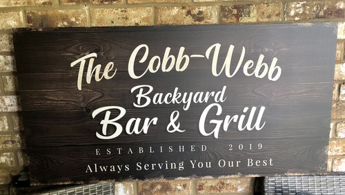 Customer photo review of Backyard Bar & Grill Sign