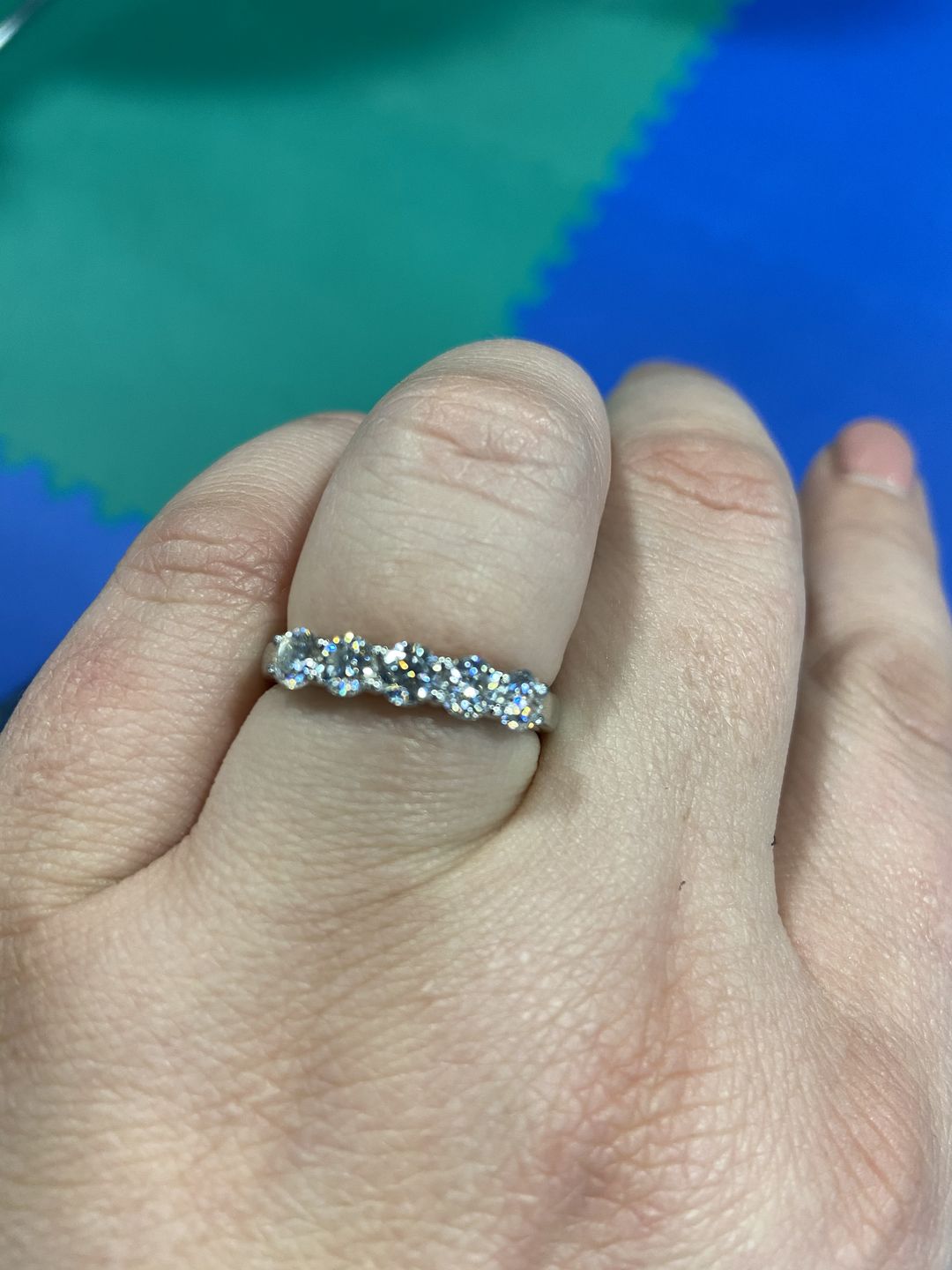 Customer photo review of Doveggs five stone moissanite wedding band/moissanite ring/lab diamond band