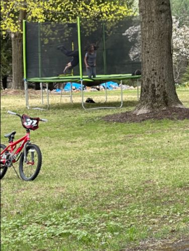 Customer photo review of Kangaroo Hoppers 15 FT Round Kids Trampoline with Safety Enclosure Net, Basketball Hoop and Ladder, Outdoor Fun Summer Trampoline