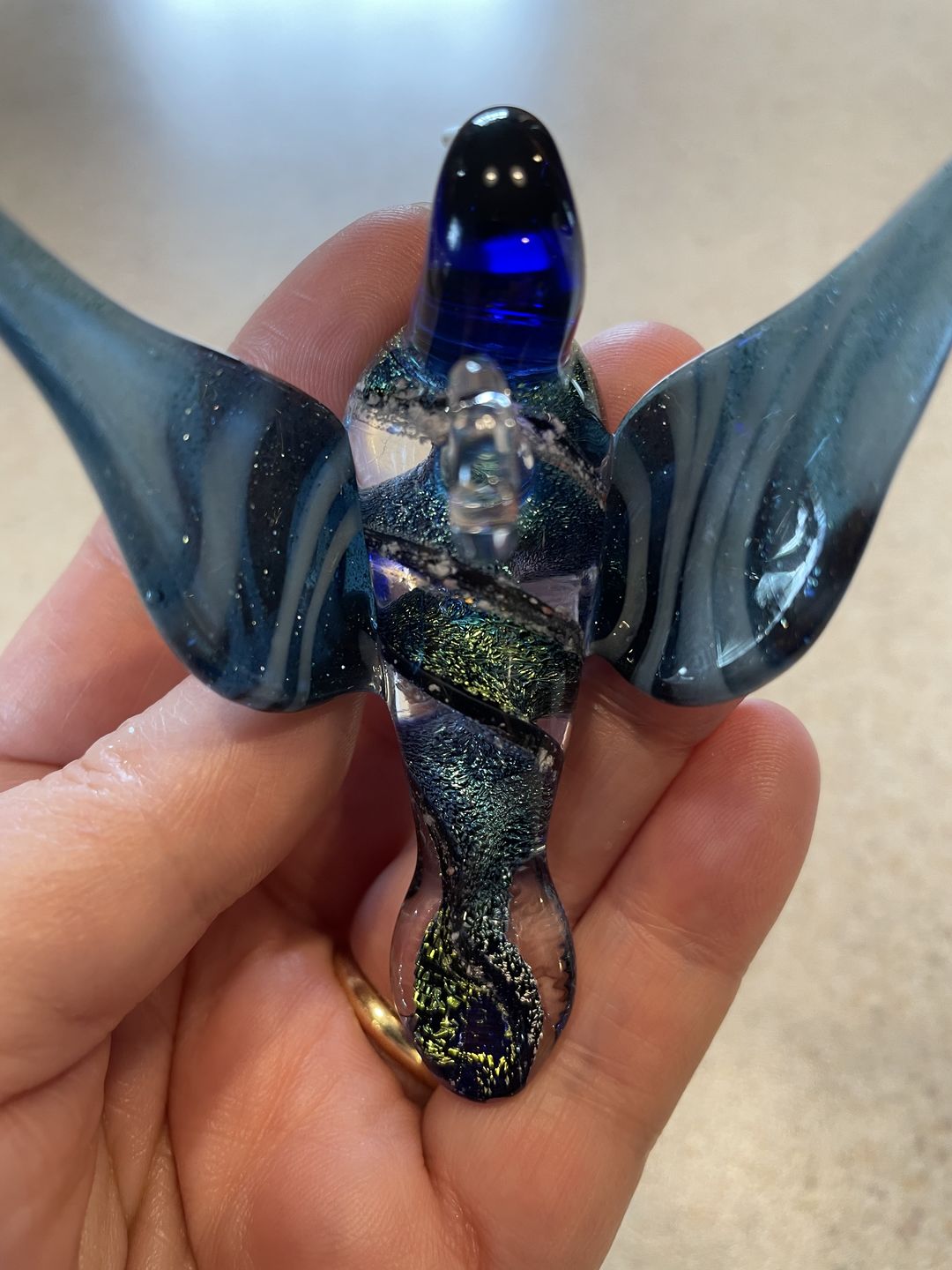 Customer photo review of Dichroic Twist Glass Hummingbird with Infused Ash