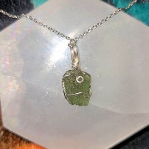 Customer photo review of Moldavite Pendant Necklace for Spiritual Awakening & Transformation.