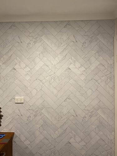 Customer photo review of Marble Herringbone Tile Wallpaper